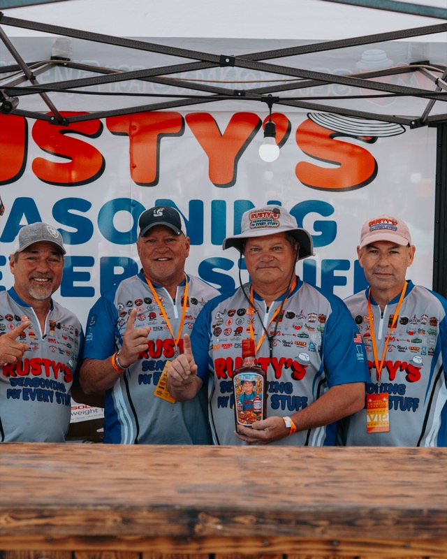 Rusty's Seasoning cook team in matching jerseys at the Crawfish Critic Cookoff